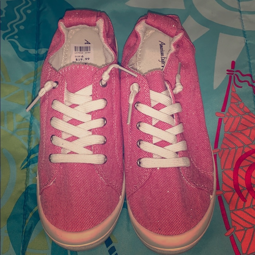 Pink slip on sneakers